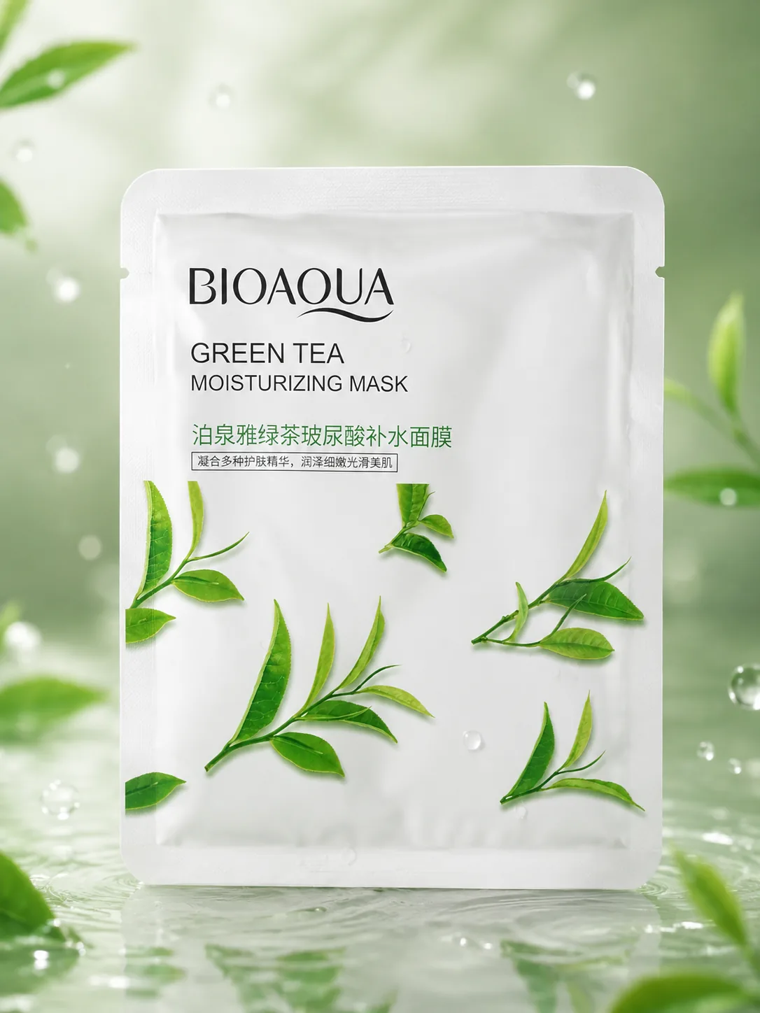 The Bioaqua Green Tea sheet mask sachet among tea leaves and water droplets